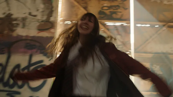 Still from Skive — arms out