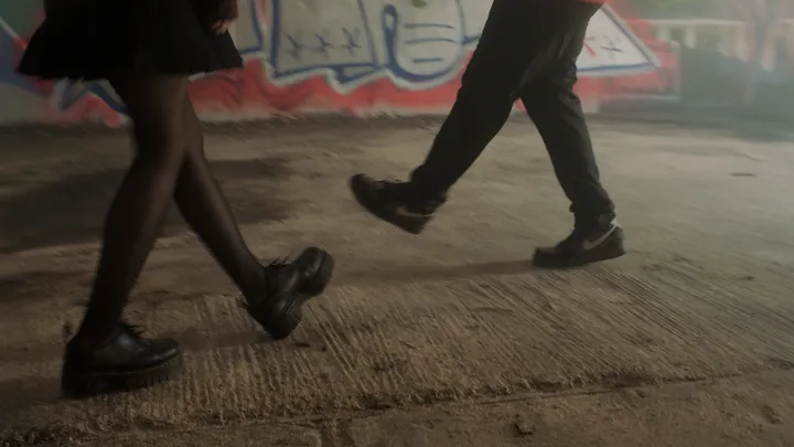 Still from Skive — walking legs