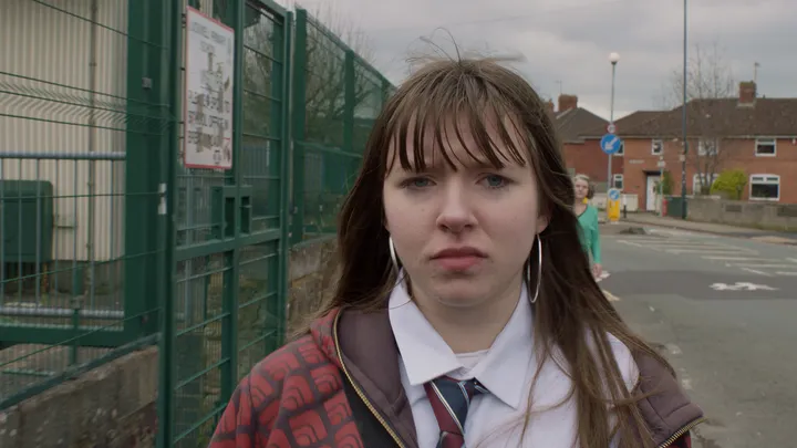 Still from Skive — school gates