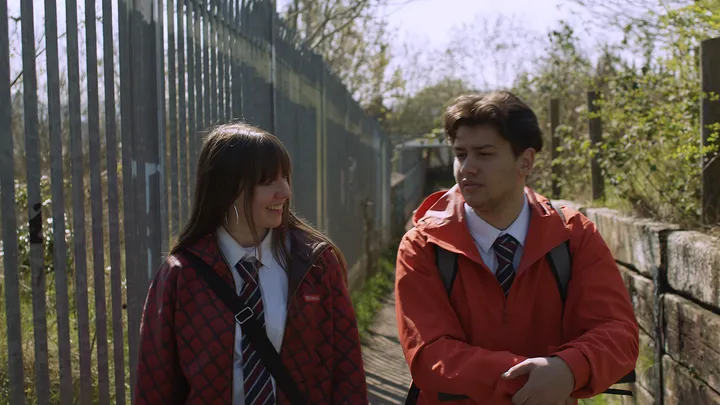 Still from Skive — fence path