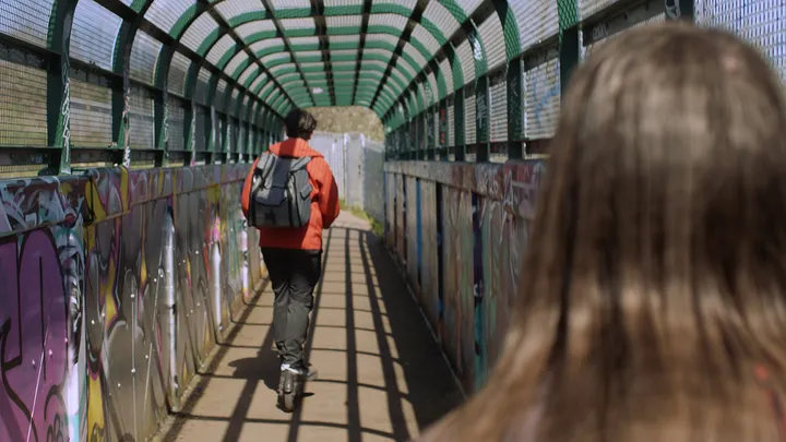 Still from Skive — green walkway