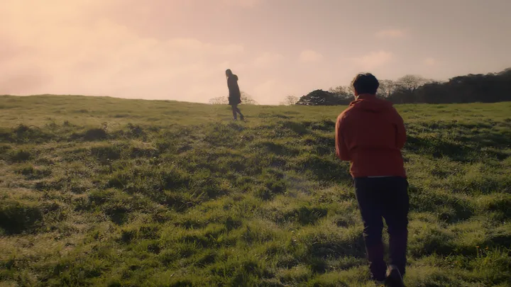 Still from Skive — field walking